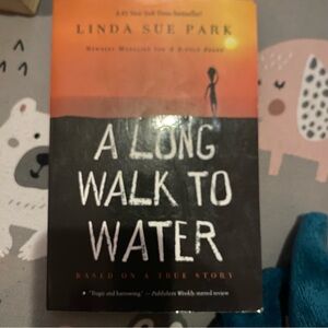A Long Walk to Water by Linda Sue Park - Orange & Black Paperback